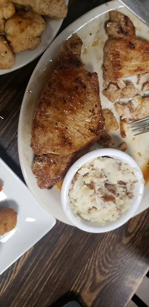 Butterfly Pork Chops Mashed Potatoes and Corn on the Cob